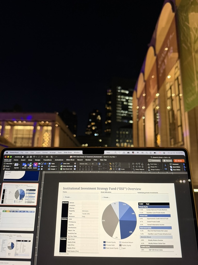 A laptop displaying the IISF portfolio presentation during development at night